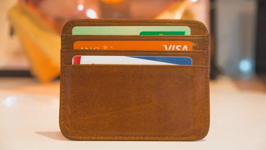 Wallet and credit cards on a desk